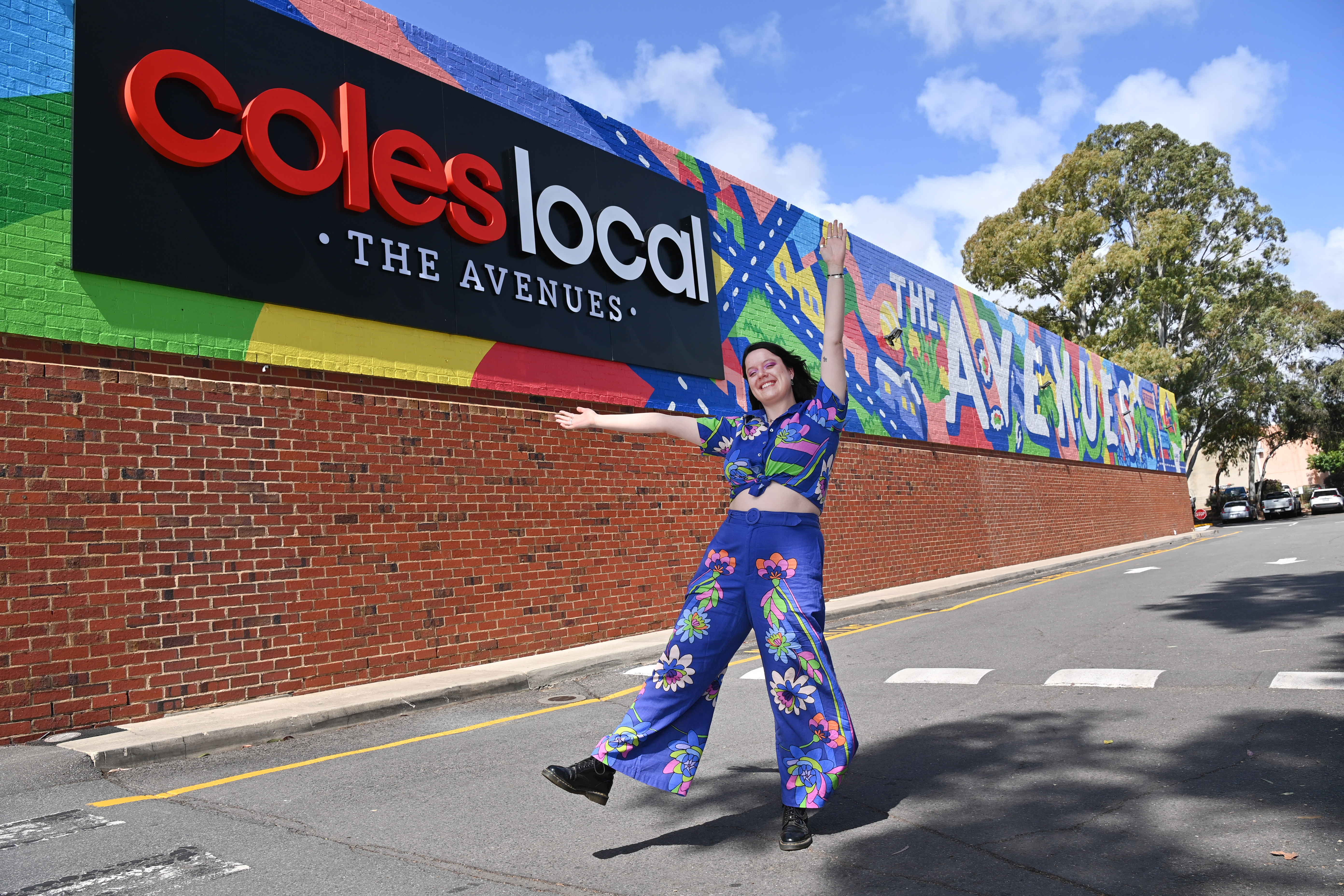 Local artist Lucinda in front of Coles Local